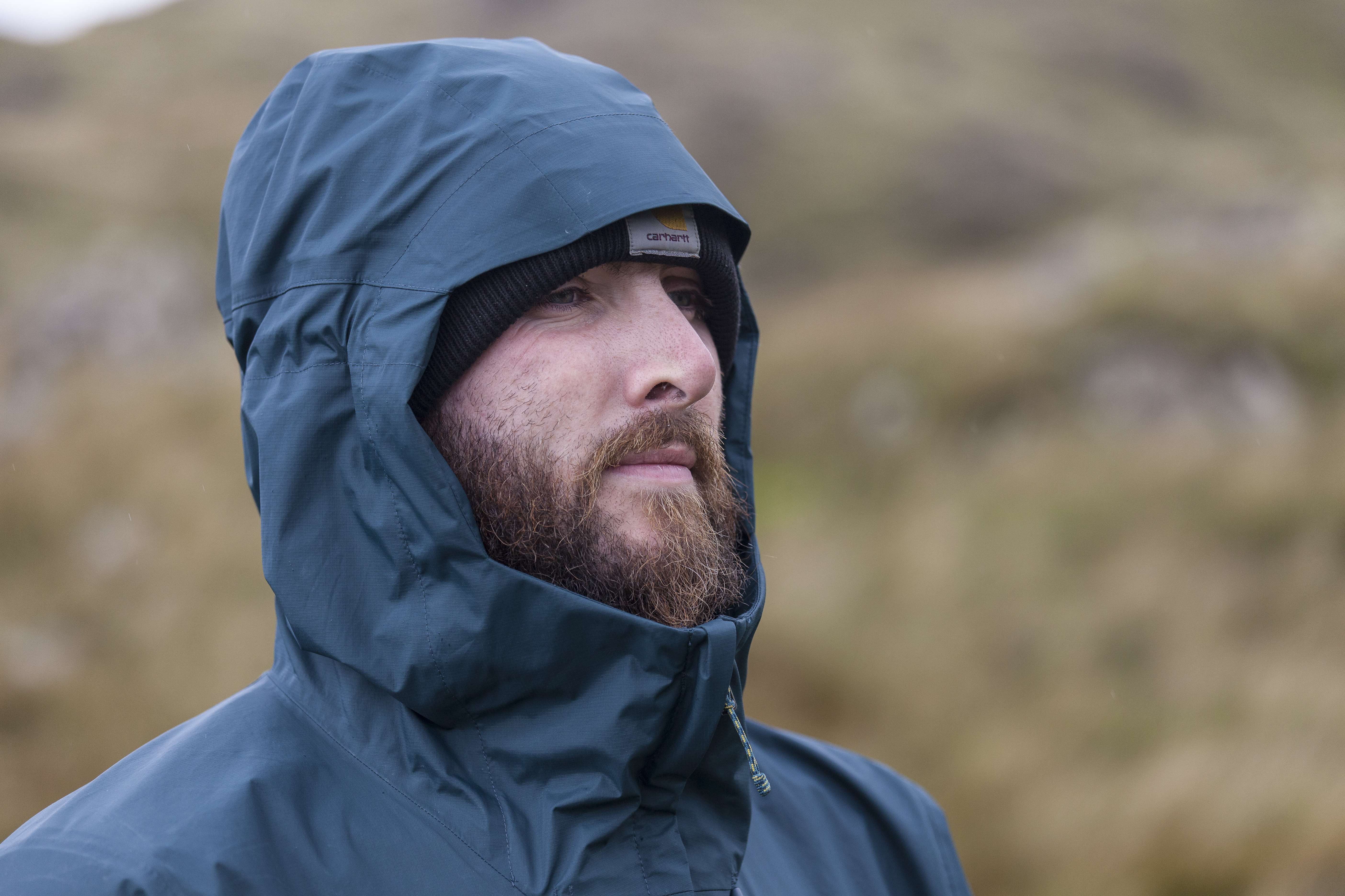 Bearded man wearing Patagonia Torrentshell jacket