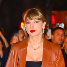 Taylor Swift wears a leather blazer