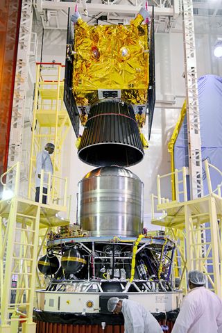 The IRNSS-1C satellite is seen here as it is assembled with India's PSLV-C26 launch vehicle.