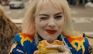 Margot Robbie as Harley Quinn with breakfast sandwich in Birds of Prey