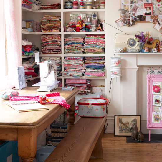 craft room with wooden table and cloths