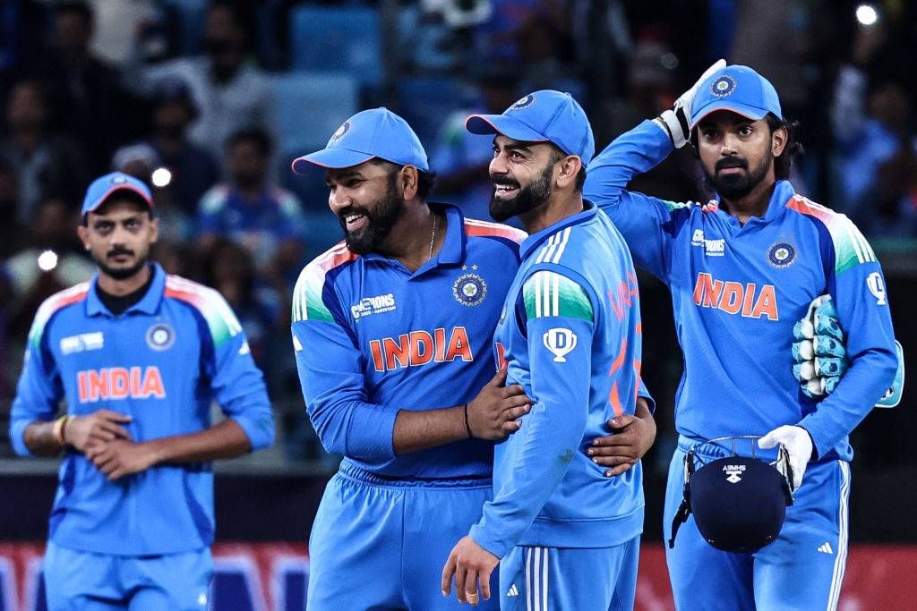 India&#039;s captain Rohit Sharma (2L) and his teammate Virat Kohli (2R) celebrate their team&#039;s win in the ICC Champions Trophy one-day international (ODI) cricket match between New Zealand and India 