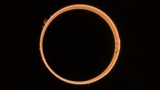 A solar eclipse where the middle of the sun is blocked but the outer ring is visible