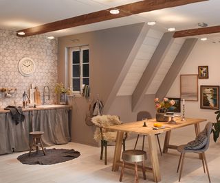 kitchen diner with wooden beams in ceiling, wooden dining table and wire and spotlight system on ceiling