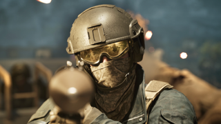 Wardogs character points weapon at the camera