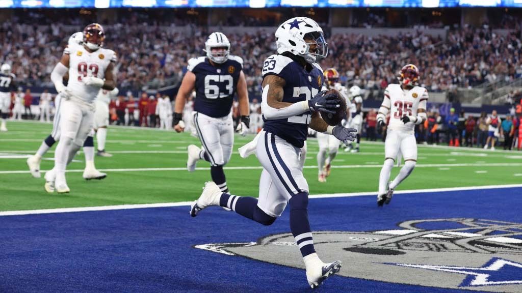 Rico Dowdle #23 of the Dallas Cowboys catch a pass for a touchdown during the first quarter in the game against the Washington Commanders at AT&amp;T Stadium on November 23, 2023 