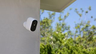 Arlo Essential XL Outdoor Camera (2nd Generation) close-up promo lifestyle