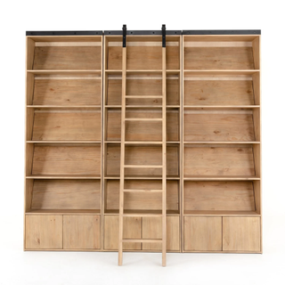 large built-in bookshelf in natural wood with ladder