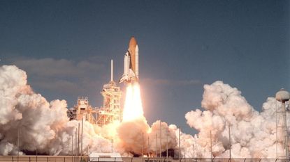 Space shuttle Columbia and its seven-member crew lifts off from Kennedy Space Center on 16 January 2003