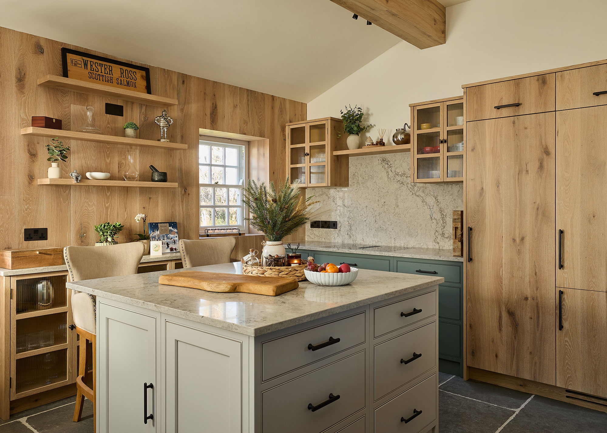 wooden kitchen with wood wall panelling and small kitchen island