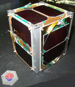 The Fox-1 cubesat satellite shown here is one of four NASA-sponsored payloads launched with the NROL-55 mission. Fox-1 is designed to host a two-way FM communications transponder and experiment payloads.