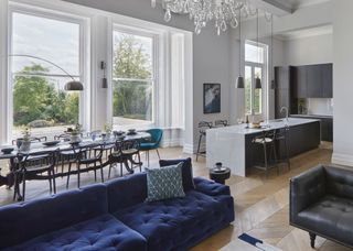 a luxe living space with a navy blue sofa