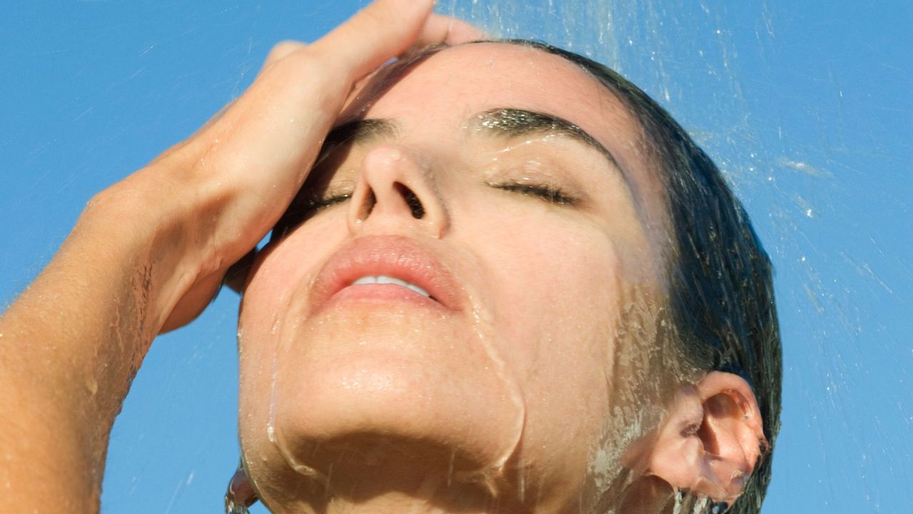 girl washing face - face wipe ban