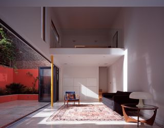 minimalist living room with black sofa