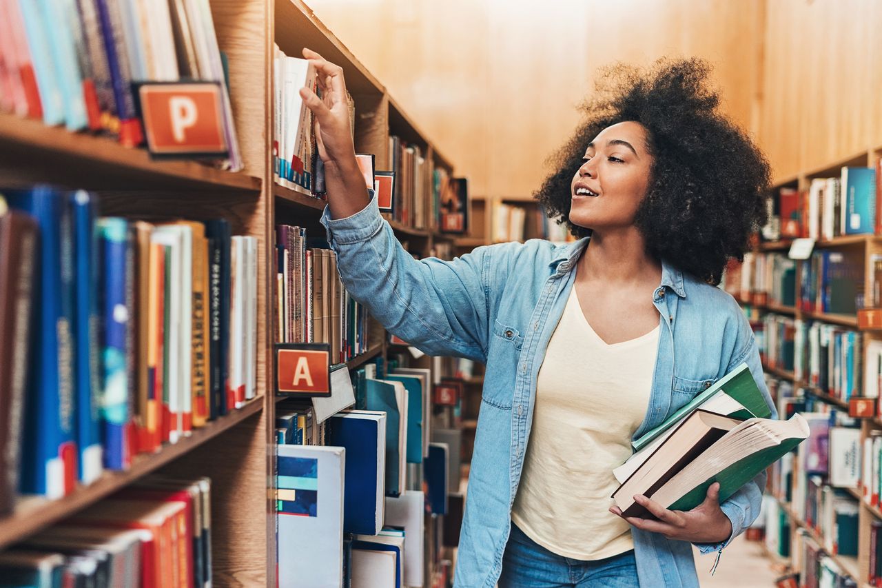 Woman choosing a book