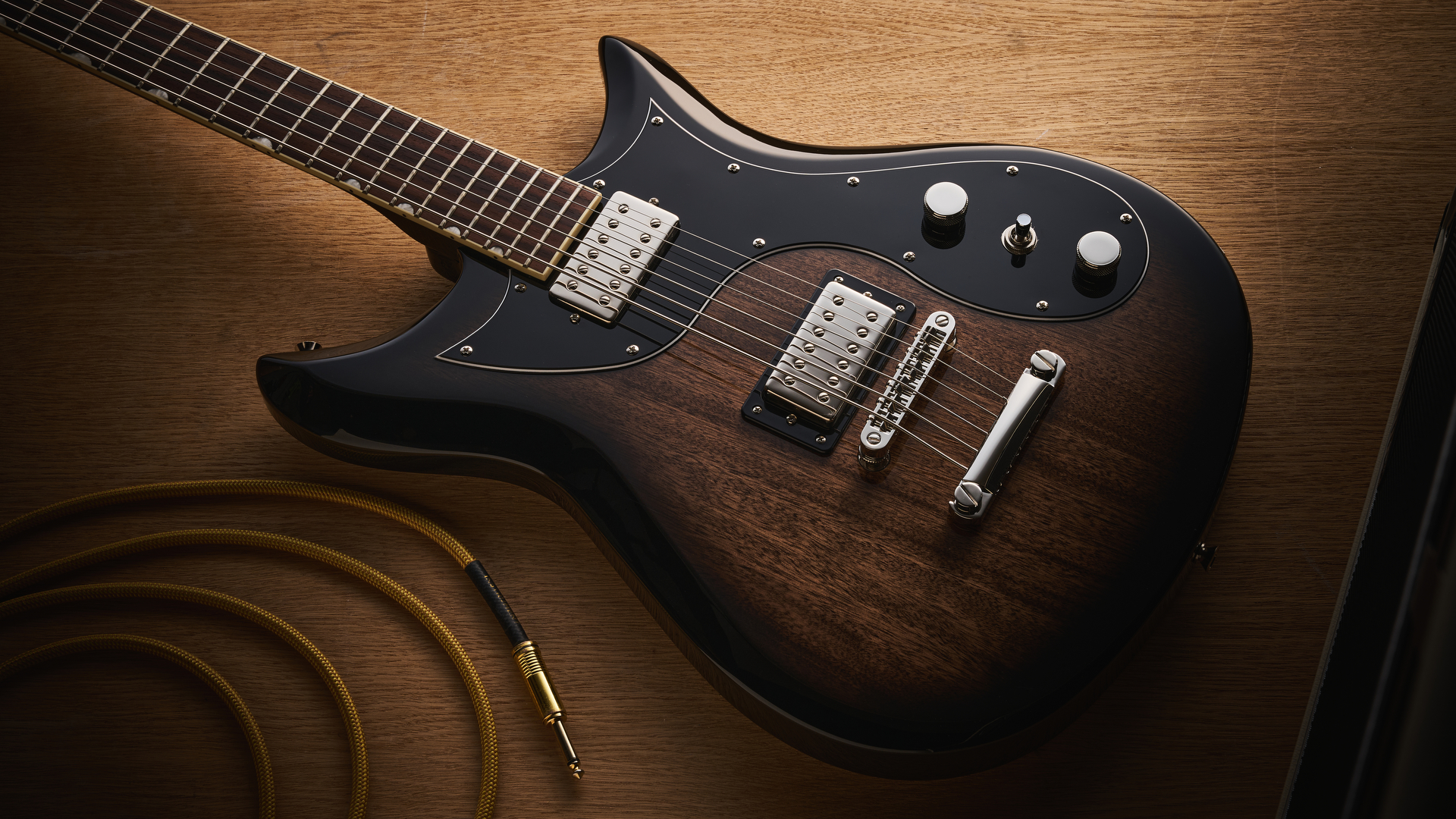 Gretsch Electromatic CVT Baritone in Bristol Fog brown sunburst finish shot on wood.