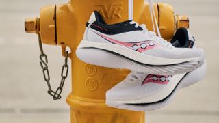 Saucony Kinvara Pro road running shoes hanging from fire hydrant