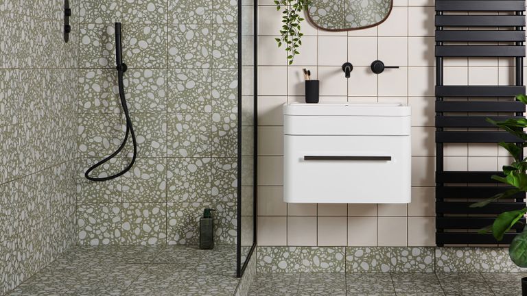 Green terrazzo tiles in a small bathroom shower idea