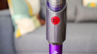 The button to reveal the integrated crevice tool on the Dyson Gen5detect's tube