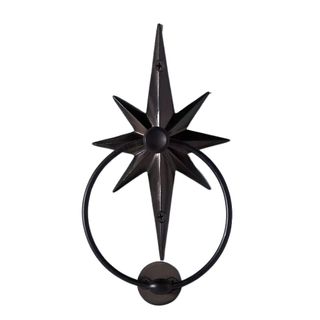 A black star-shaped door knocker