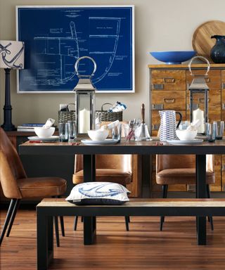 nautical dining room with laminate flooring and dark wood furniture