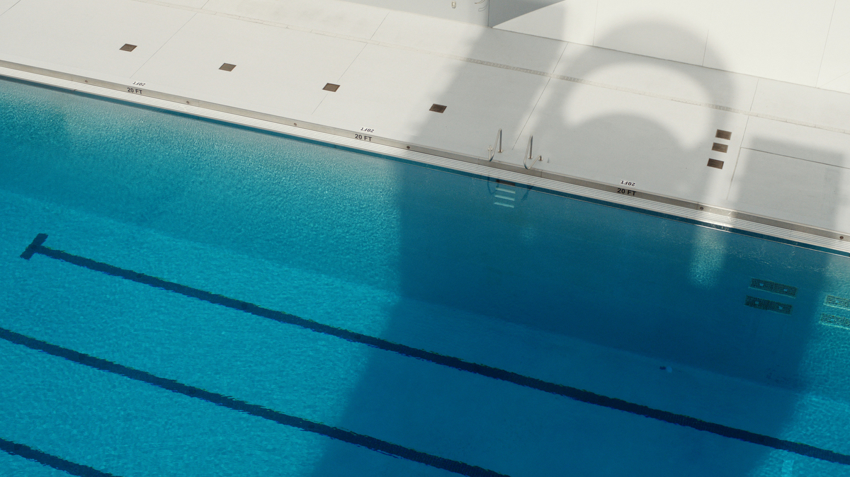 swimming pool seen from high diving board