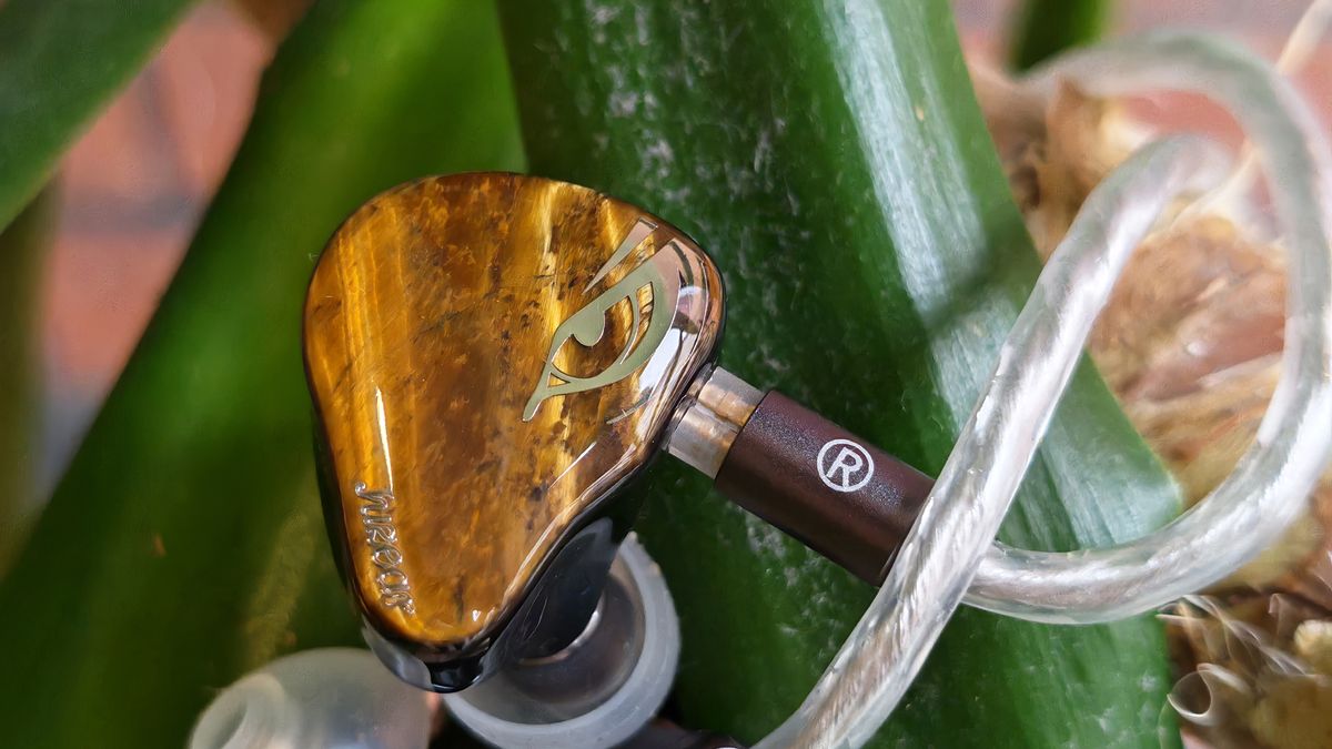 A selection of photos of the Juzear Harrier in-ear monitor, amongst green plants and coffee cups.