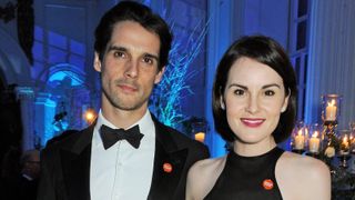 ohn Dineen (L) and Michelle Dockery attend the Winter Whites Gala in aid of Centrepoint at Kensington Palace on November 26, 2013 in London, England.