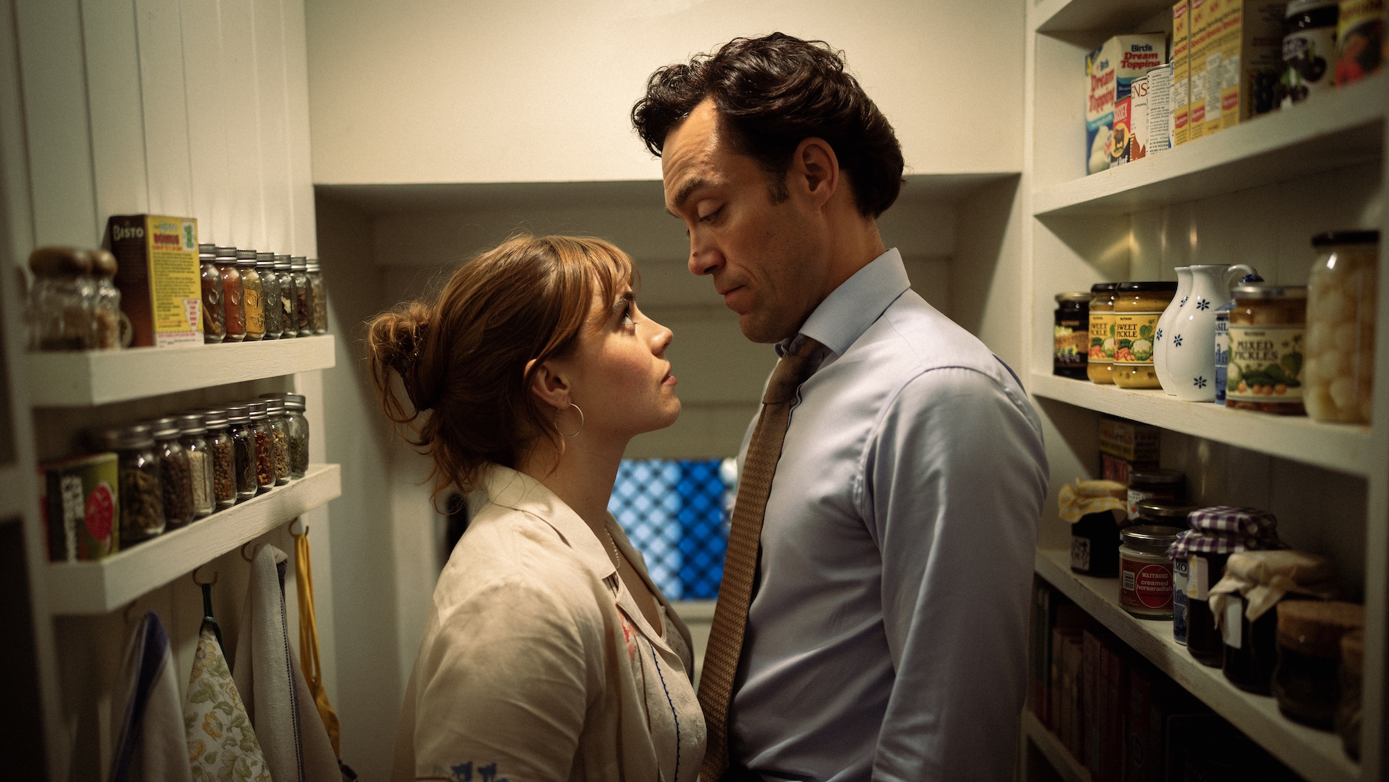 Promotion image for the second series of Rivals, showing Taggie O'Hara and Rupert Campbell-Black facing each other in a larder.