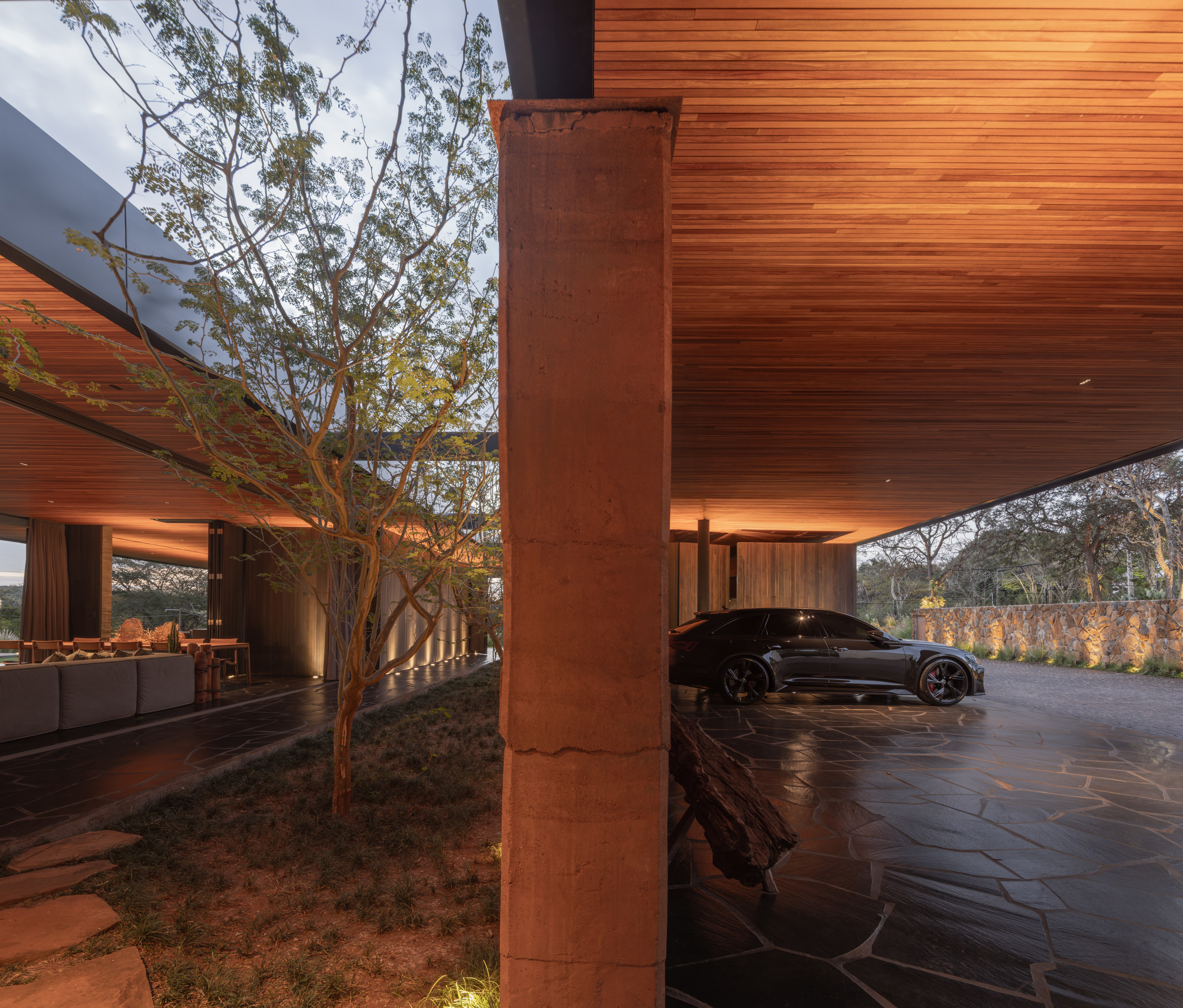 An internal courtyard divides the car port from the entrance to the main living space