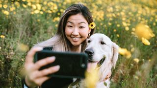 Woman talking selfie with dog