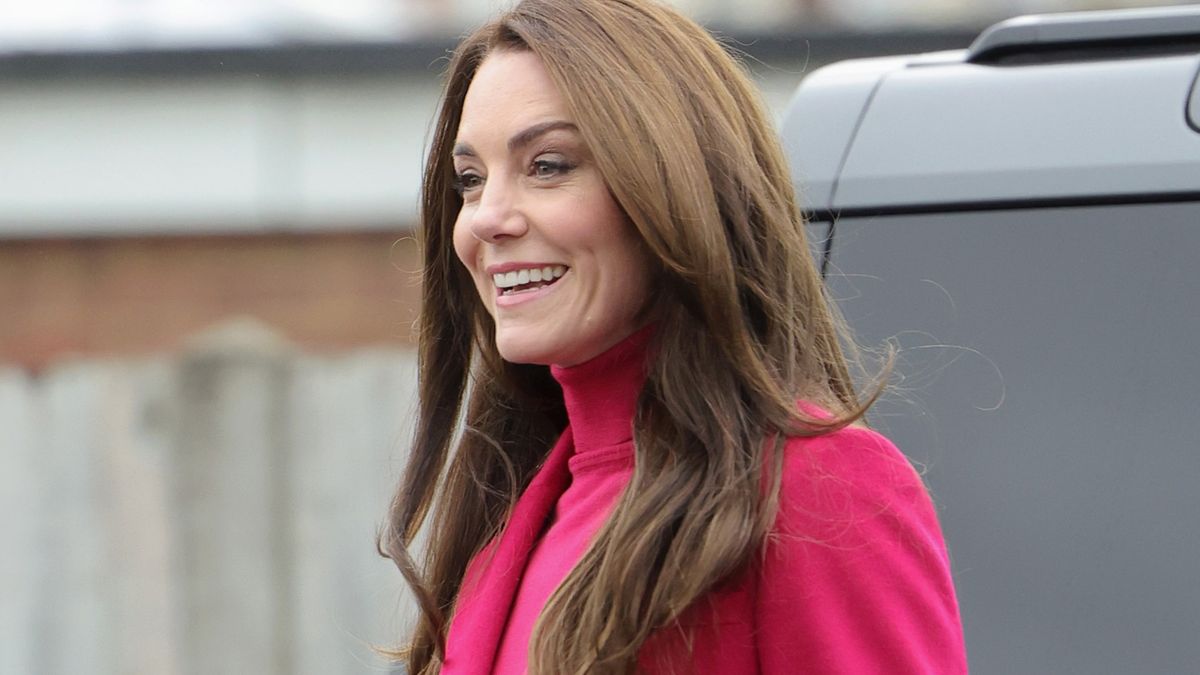 Kate Middleton channels her inner 70s goddess in powerful flares and bright berry turtleneck