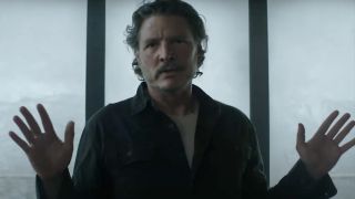 Pedro Pascal as Joel putting his hands up on The Last of Us