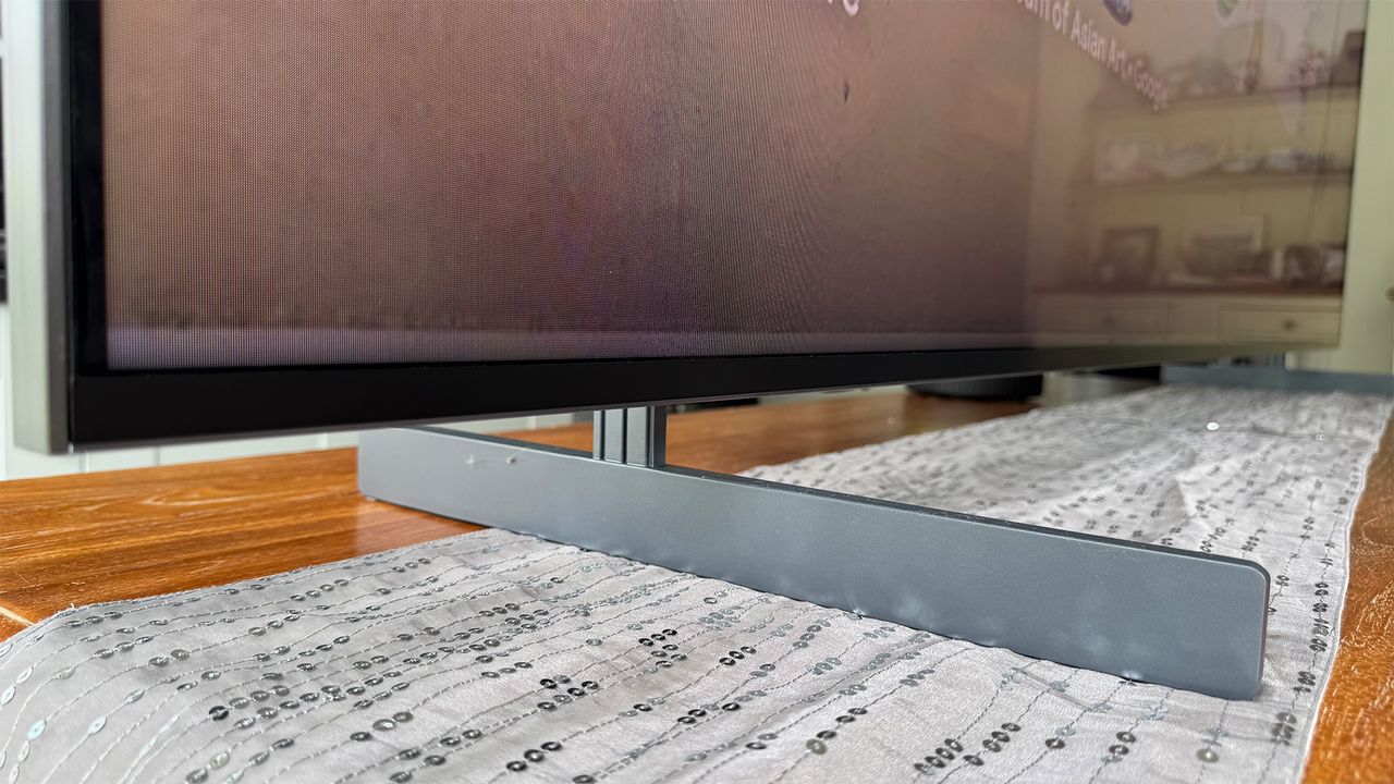 A close-up of the blade-style feet of the TCL 98C7K 98-inch TV.