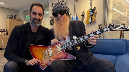 Gibson CEO Cesar Gueikian presents ZZ Top frontman Billy F. Gibbons with a custom Explorer that he designed and built himself.