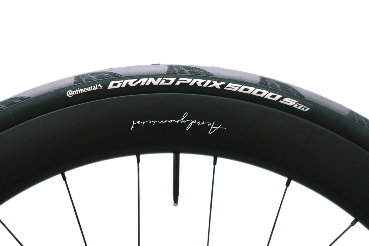 a close up of a black road bike tyre