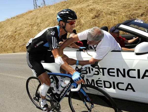 Kurt-Asle Arvesen (Sky Procycling) receives medical attention before abandoningi the stage after a crash yesterday