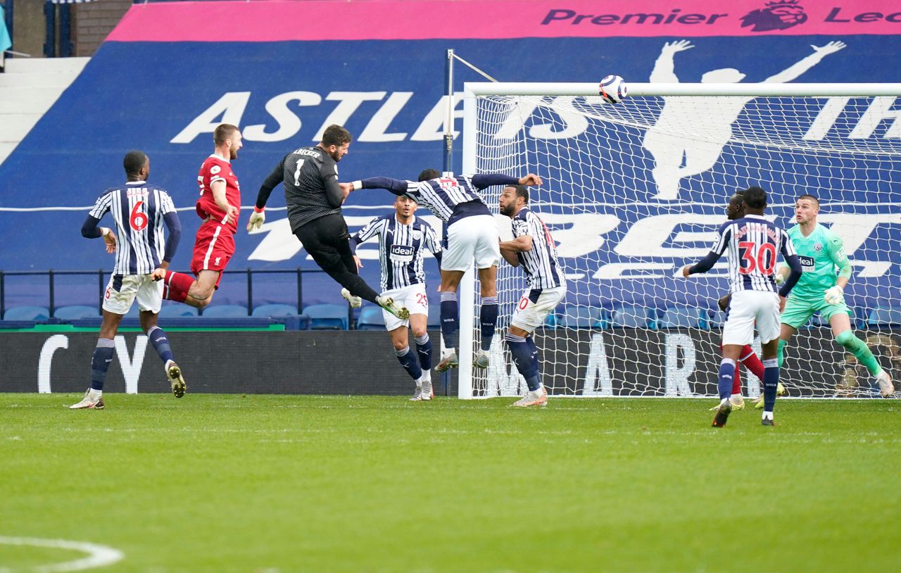 Liverpool goalkeeper Alisson scores the winning goal against West Bromwich Albion in the Premier League match at the Hawthorns, May 2021