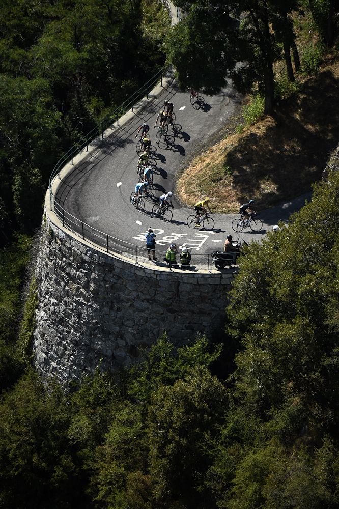 Riders round a switchback on the Col du Glandon.