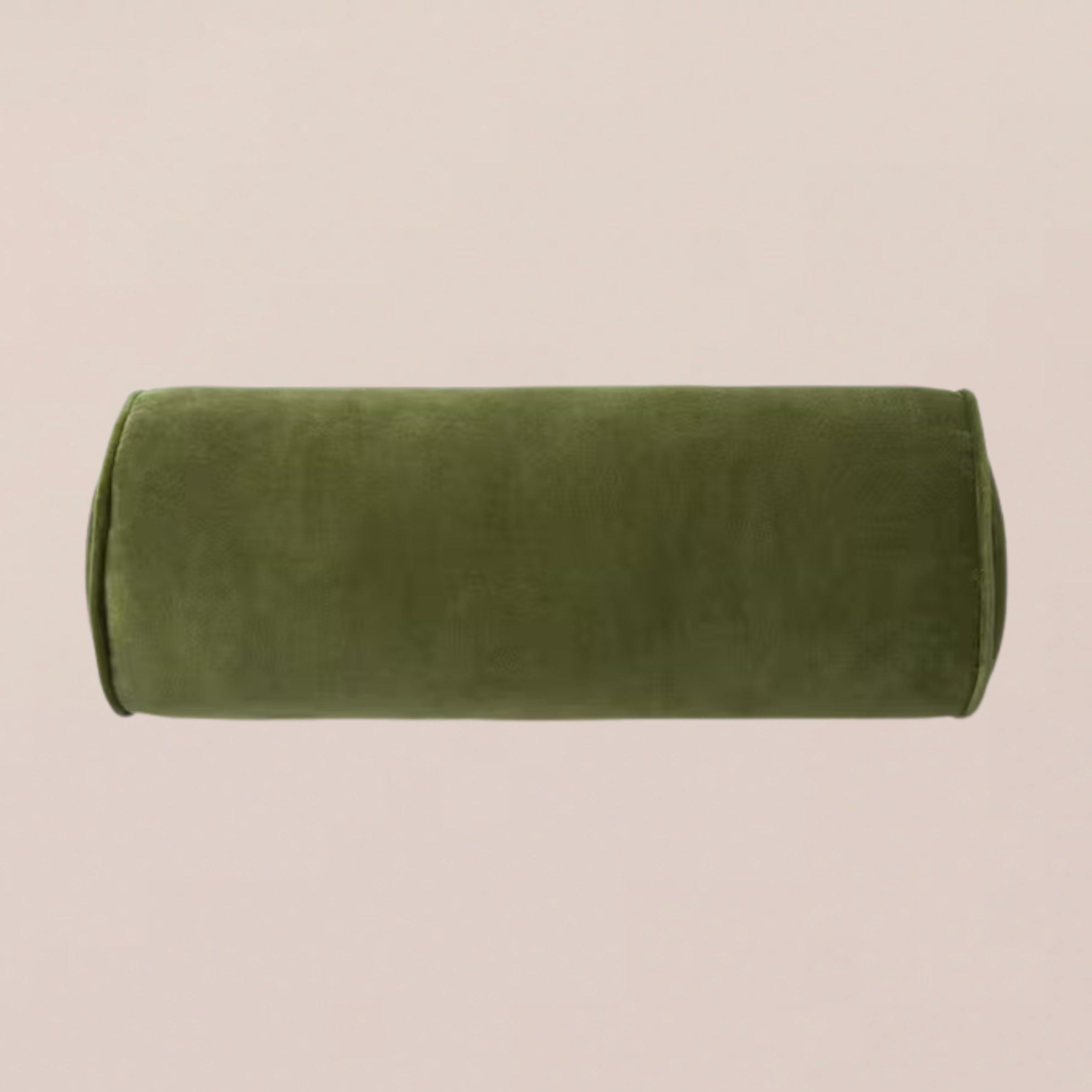 A green velvet bolster pillow