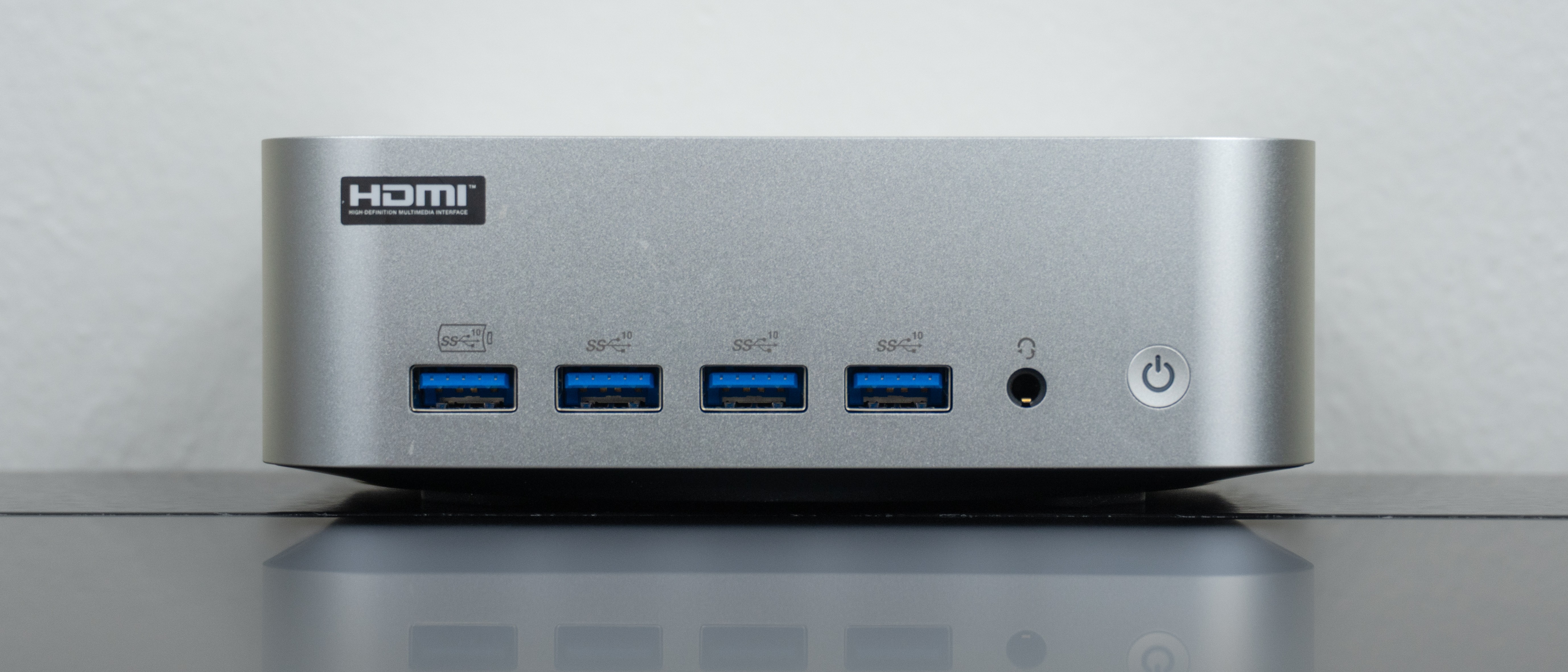 The Geekom A9 Max 2026 Edition on a desk showing off its front ports