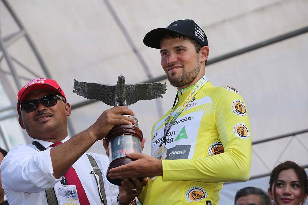 Reinardt Janse Van Rensburg (Dimension Data) takes the winner's trophy