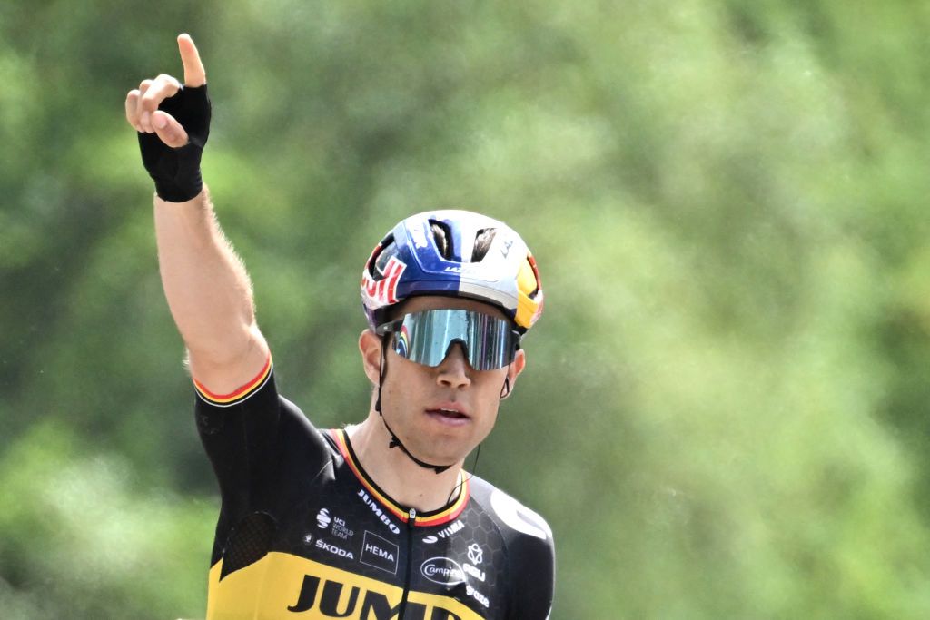 JumboVisma teams Belgian rider Wout Van Aert celebrates as he crosses the finish line and wins the first stage of the 74th edition of the Criterium du Dauphine cycling race 192 km between La VoultesurRhone and Beauchastel on June 5 2022 Photo by Marco BERTORELLO AFP Photo by MARCO BERTORELLOAFP via Getty Images