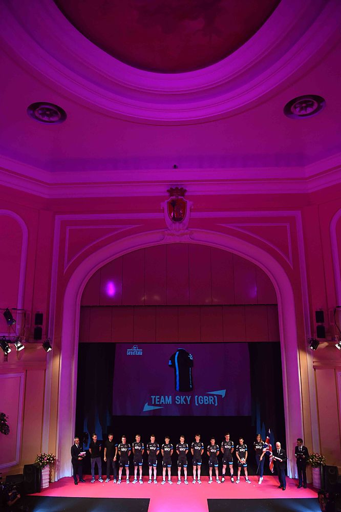 Team Sky on stage with pink lighting