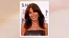 Image of Davina McCall smiling with a brunette long bob and curtain bangs, wearing a strapless brown leather dress, on a pink watercolour background