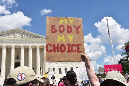 Abortion rights activists march to the U.S. Supreme Court on June 24, 2023