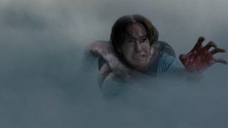 Chris Owen as Norm, a bag boy, getting pulled into The Mist