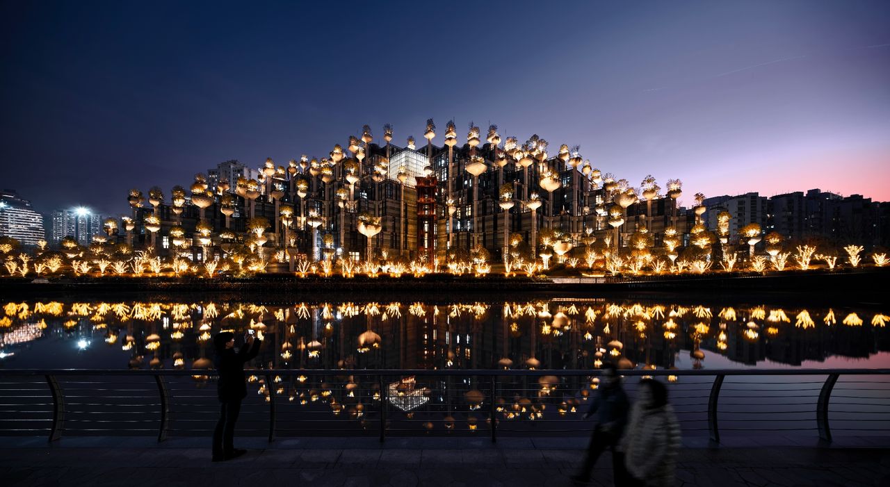 Thomas Heatherwick&#039;s 1000 Trees development in Shanghai seen at night with dramatic lighting