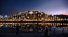 Thomas Heatherwick's 1000 Trees development in Shanghai seen at night with dramatic lighting