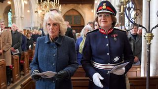 Camilla, Duchess of Cornwall and Lord-Lieutenant of Wilshire, Mrs Sarah Troughton attend a church service during a visit to Wiltshire on December 02, 2021 in Melksham, United Kingdom. Camilla, Duchess of Cornwall attends a short service of Rededication and lays flowers to mark the 100th anniversary of the Seend War Memorial at The Church of The Holy Cross.